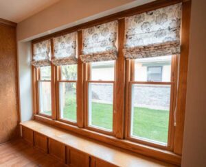 a row of hung windows with interior wood frames