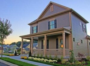 attractive siding installed on a two-story home with a large porch
